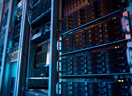 Rows of illuminated data center servers