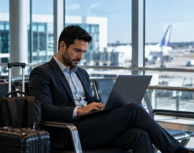 Remote Device Security Business professional using a laptop securely while working remotely